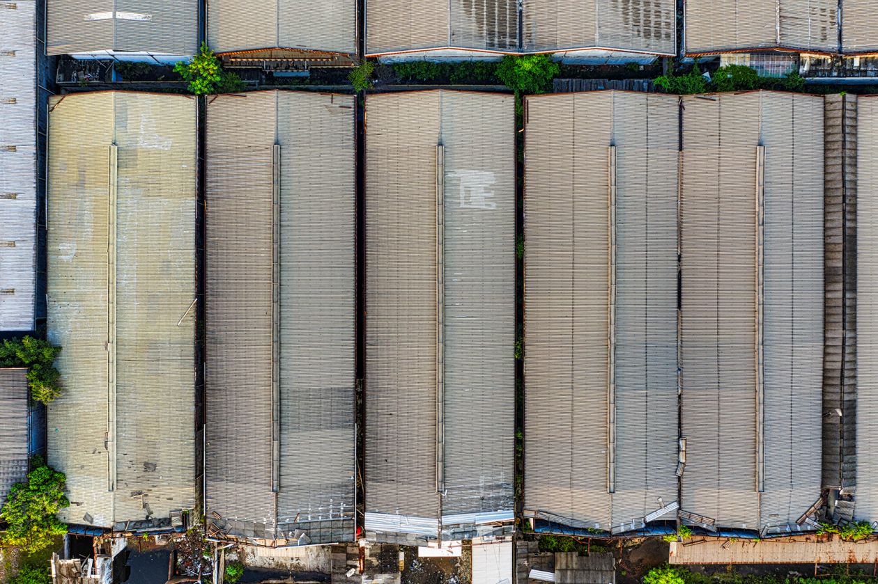 Aerial view of large warehouse roofs